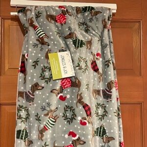 Holiday Dachshund themed throw blanket.